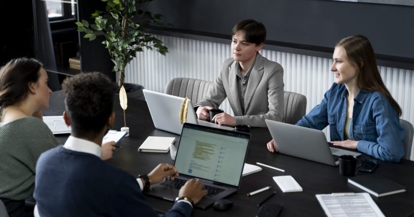 trans-person-working-office-with-colleagues